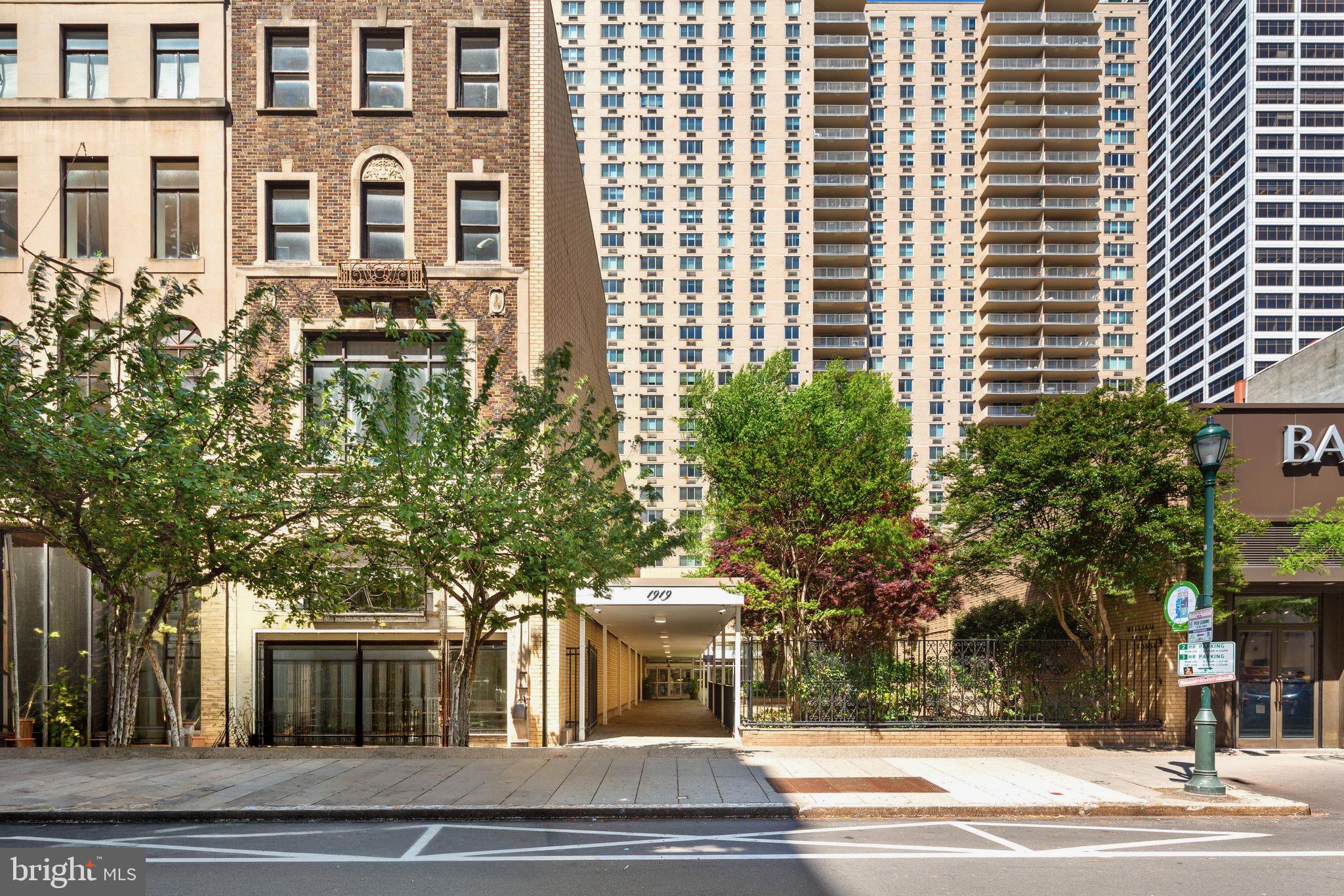 a view of a building and a tree
