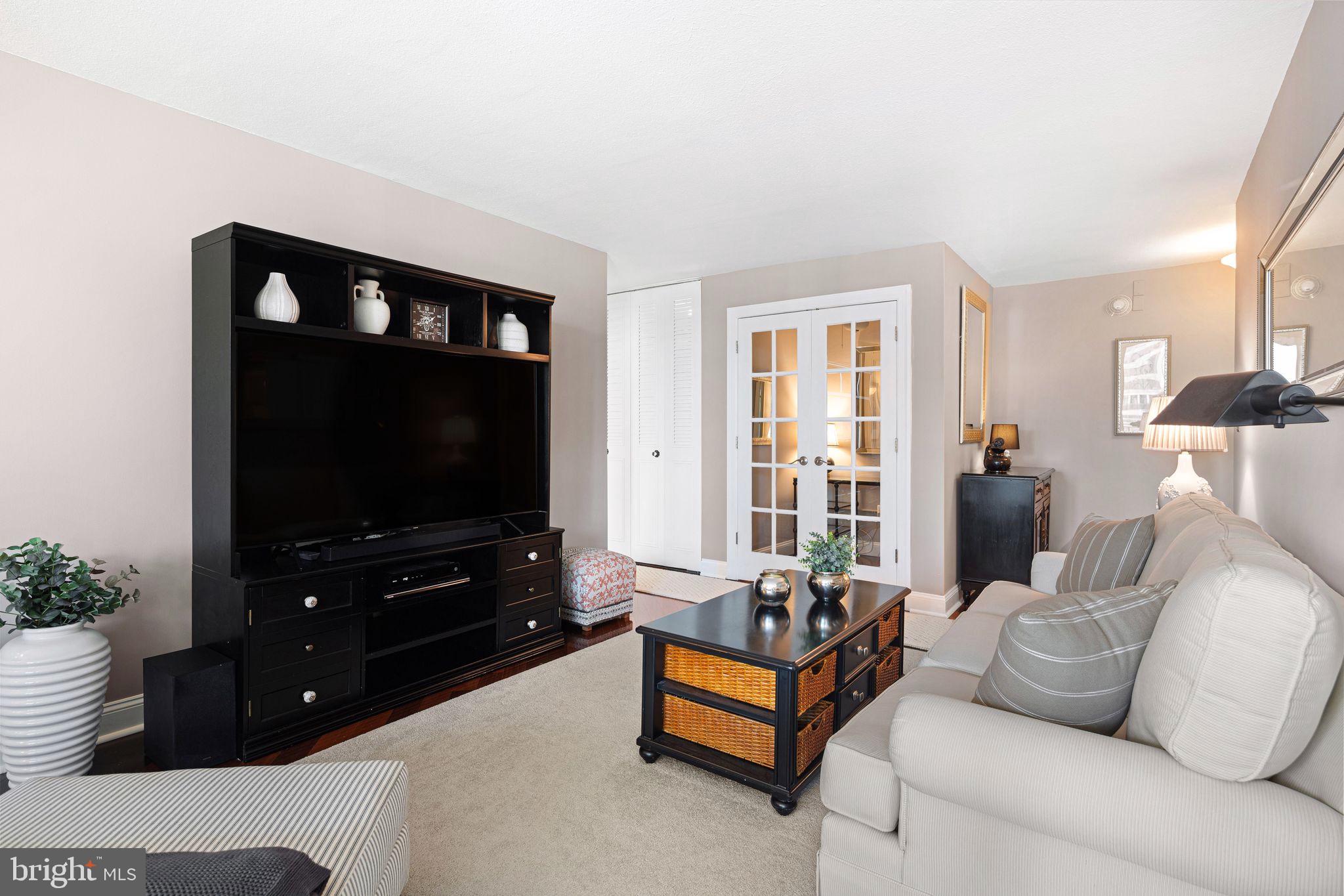 1919 Chestnut Street, Unit 2016 Philadelphia, PA 19103 - Photo 11 of 34 a living room with furniture and a flat screen tv
