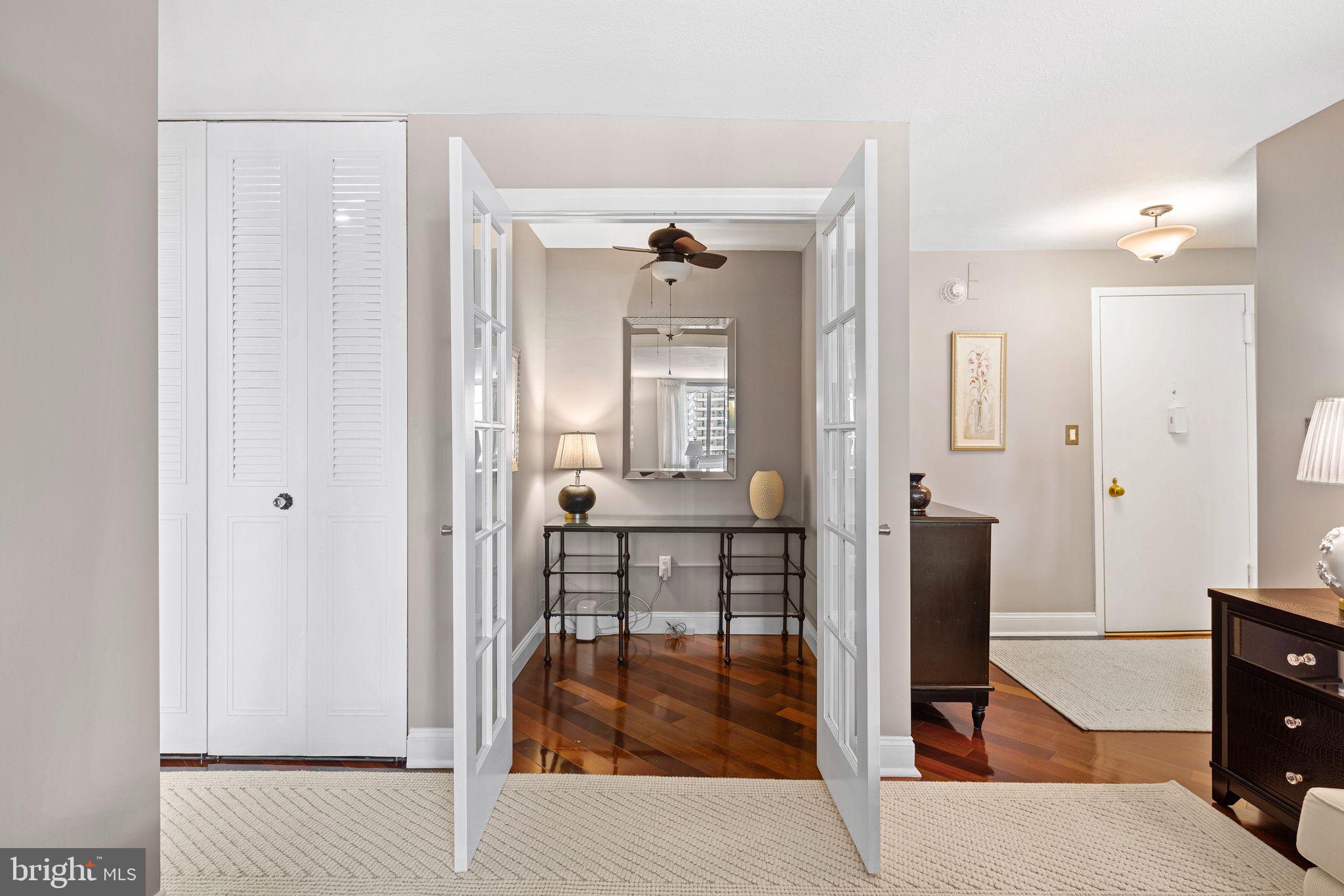 1919 Chestnut Street, Unit 2016 Philadelphia, PA 19103 - Photo 12 of 34 a view of a hallway with dining area and glass door