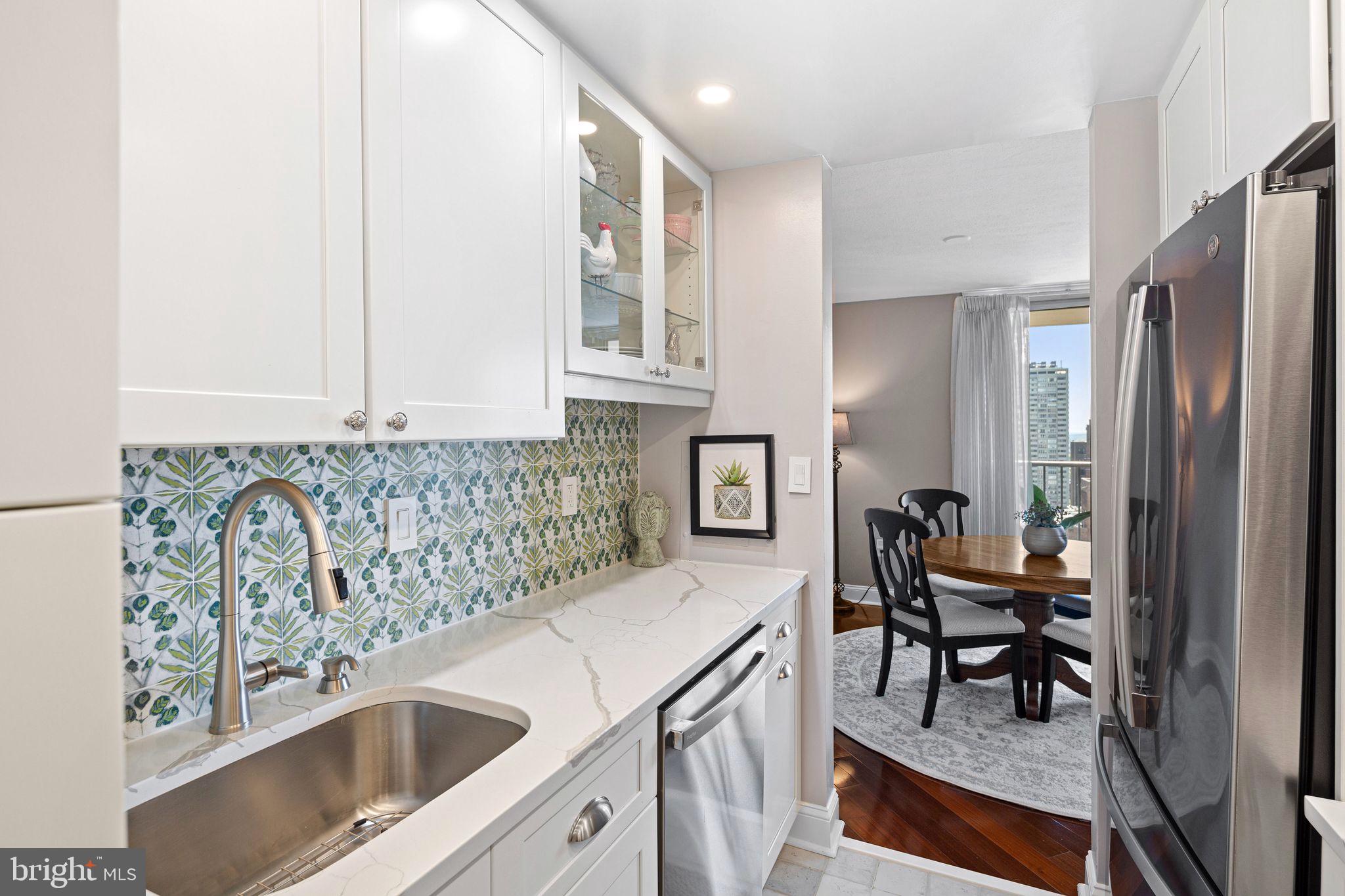 1919 Chestnut Street, Unit 2016 Philadelphia, PA 19103 - Photo 15 of 34 a kitchen with stainless steel appliances granite countertop a sink and a refrigerator