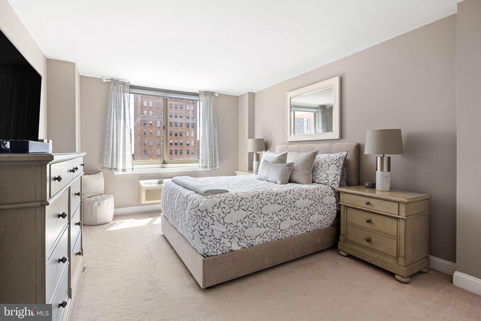 1919 Chestnut Street, Unit 2016 Philadelphia, PA 19103 - Photo 23 of 34 a bedroom with a bed and a flat screen tv