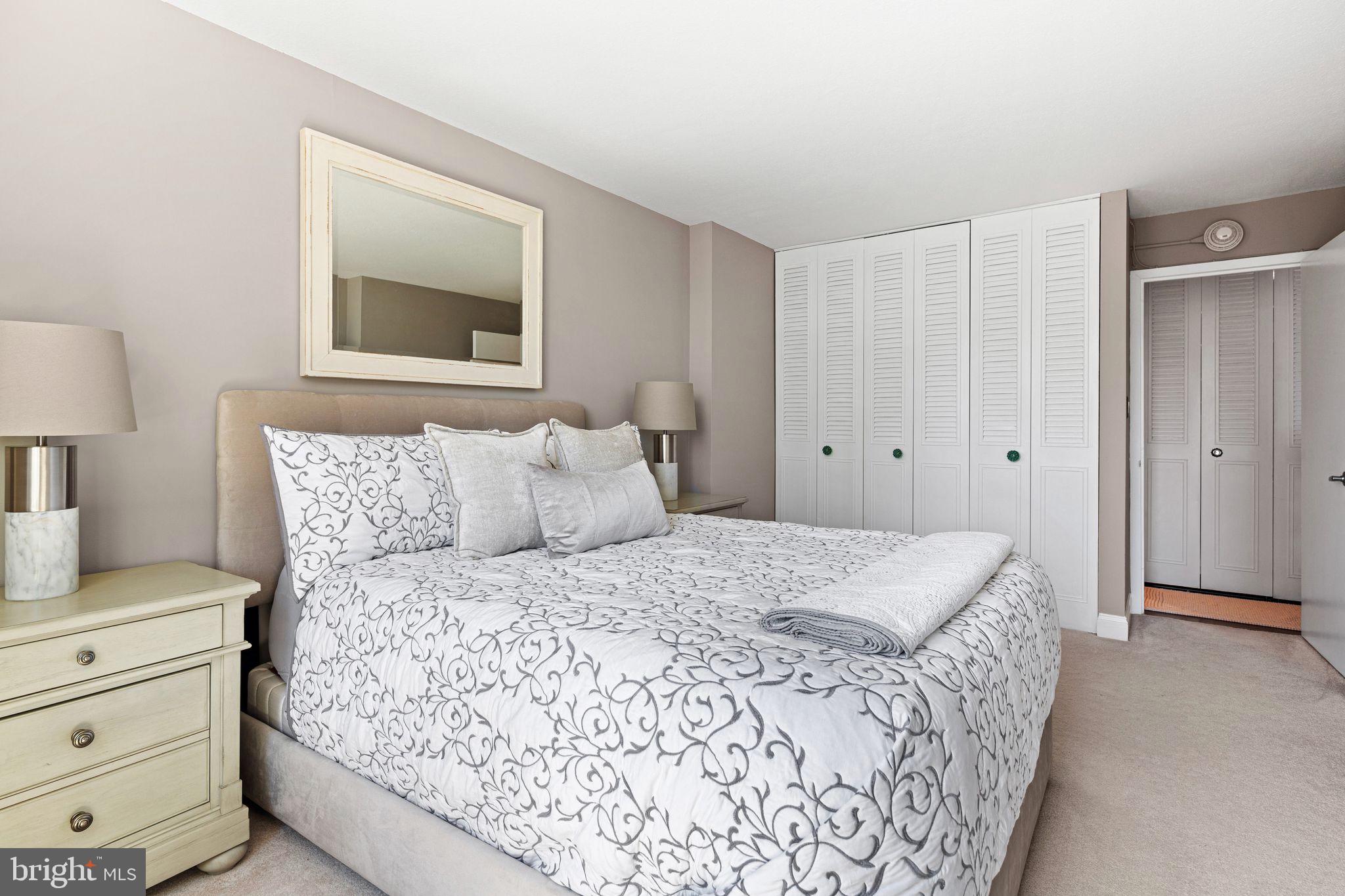 1919 Chestnut Street, Unit 2016 Philadelphia, PA 19103 - Photo 24 of 34 a bedroom with a bed and a night stand