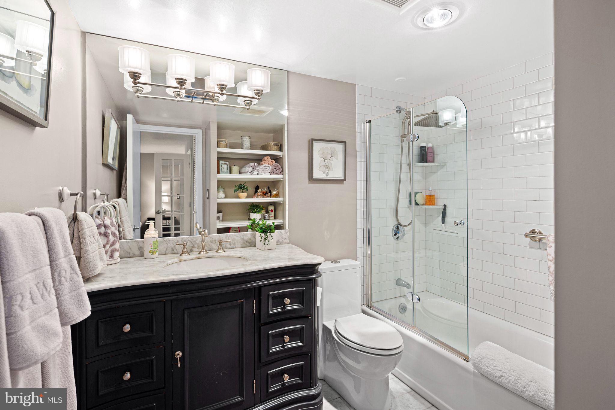 1919 Chestnut Street, Unit 2016 Philadelphia, PA 19103 - Photo 27 of 34 a bathroom with a sink vanity toilet and shower