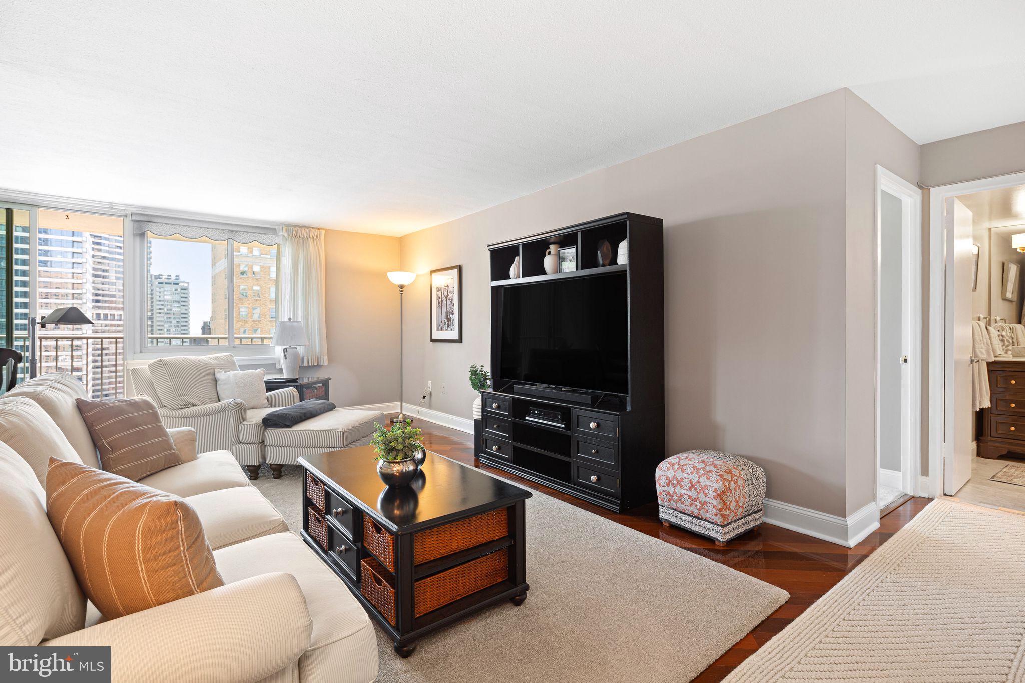 1919 Chestnut Street, Unit 2016 Philadelphia, PA 19103 - Photo 3 of 34 a living room with furniture and a flat screen tv