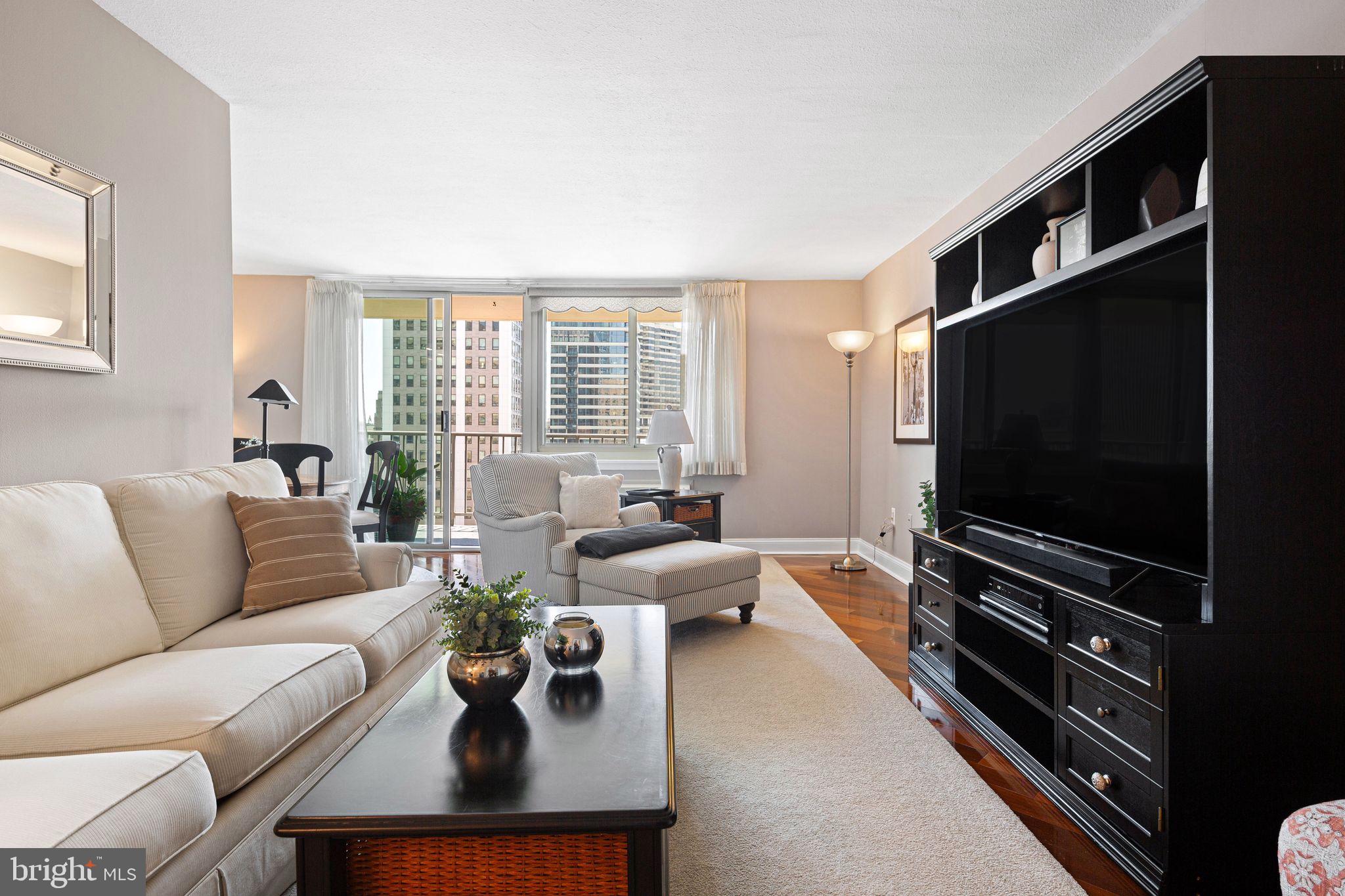 1919 Chestnut Street, Unit 2016 Philadelphia, PA 19103 - Photo 4 of 34 a living room with furniture and a flat screen tv