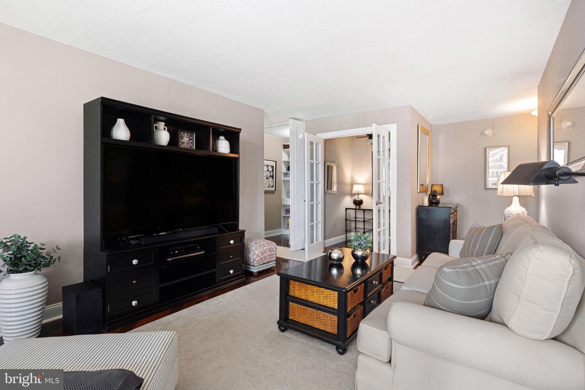 1919 Chestnut Street, Unit 2016 Philadelphia, PA 19103 - Photo 6 of 34 a living room with furniture and a flat screen tv