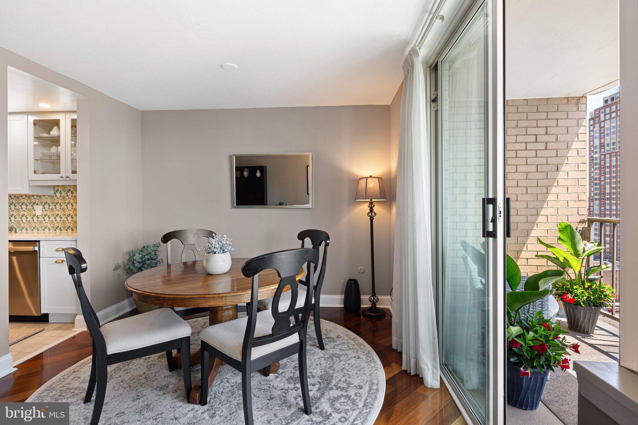 1919 Chestnut Street, Unit 2016 Philadelphia, PA 19103 - Photo 10 of 34 a dining room with furniture and a potted plant