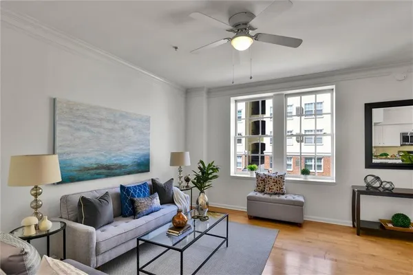 a living room with furniture and a flat screen tv