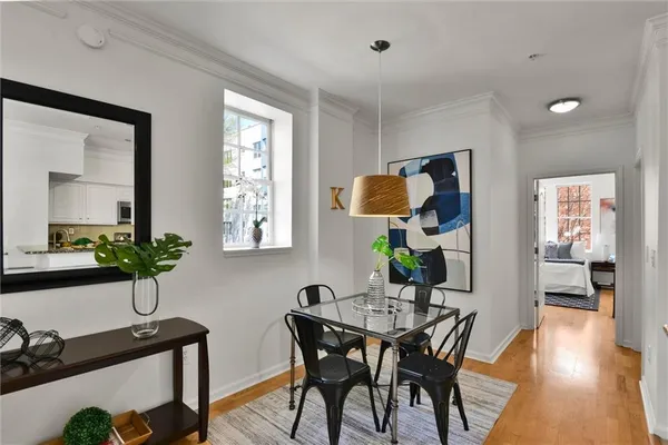 a view of a dining room with furniture window and wooden floor
