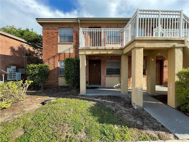 a view of house with a porch and furniture