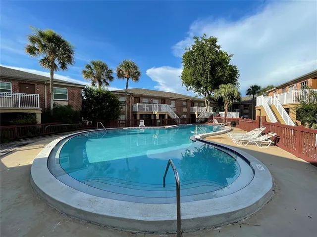 a view of a house with swimming pool
