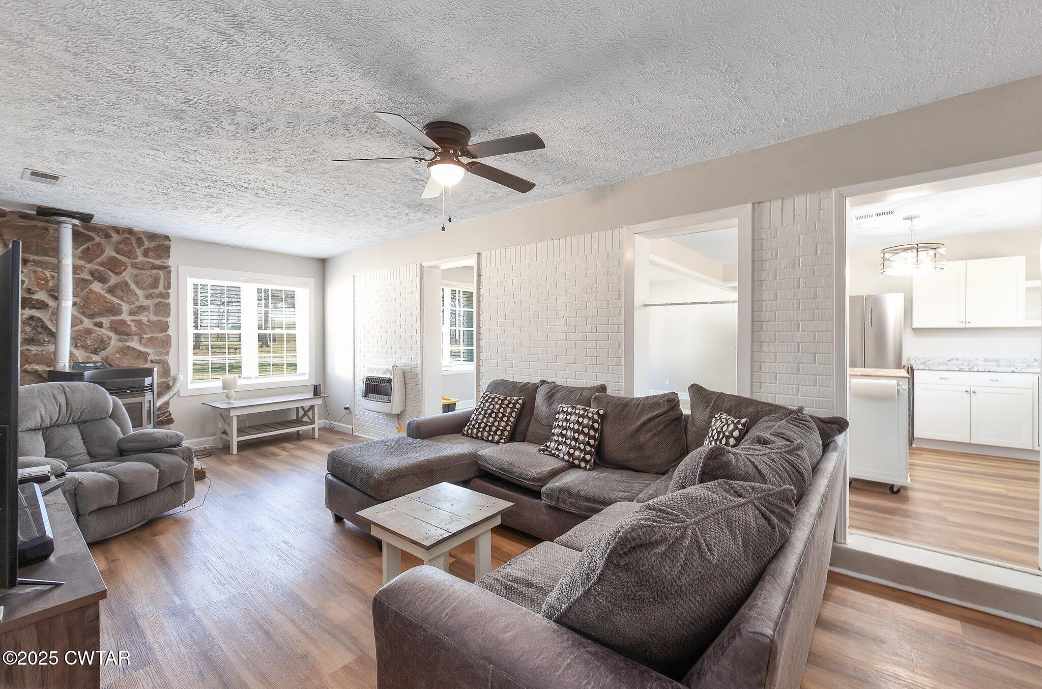 4260 Old Friendship Road Finger, TN 38334 - Photo 12 of 26 a living room with furniture and a large window