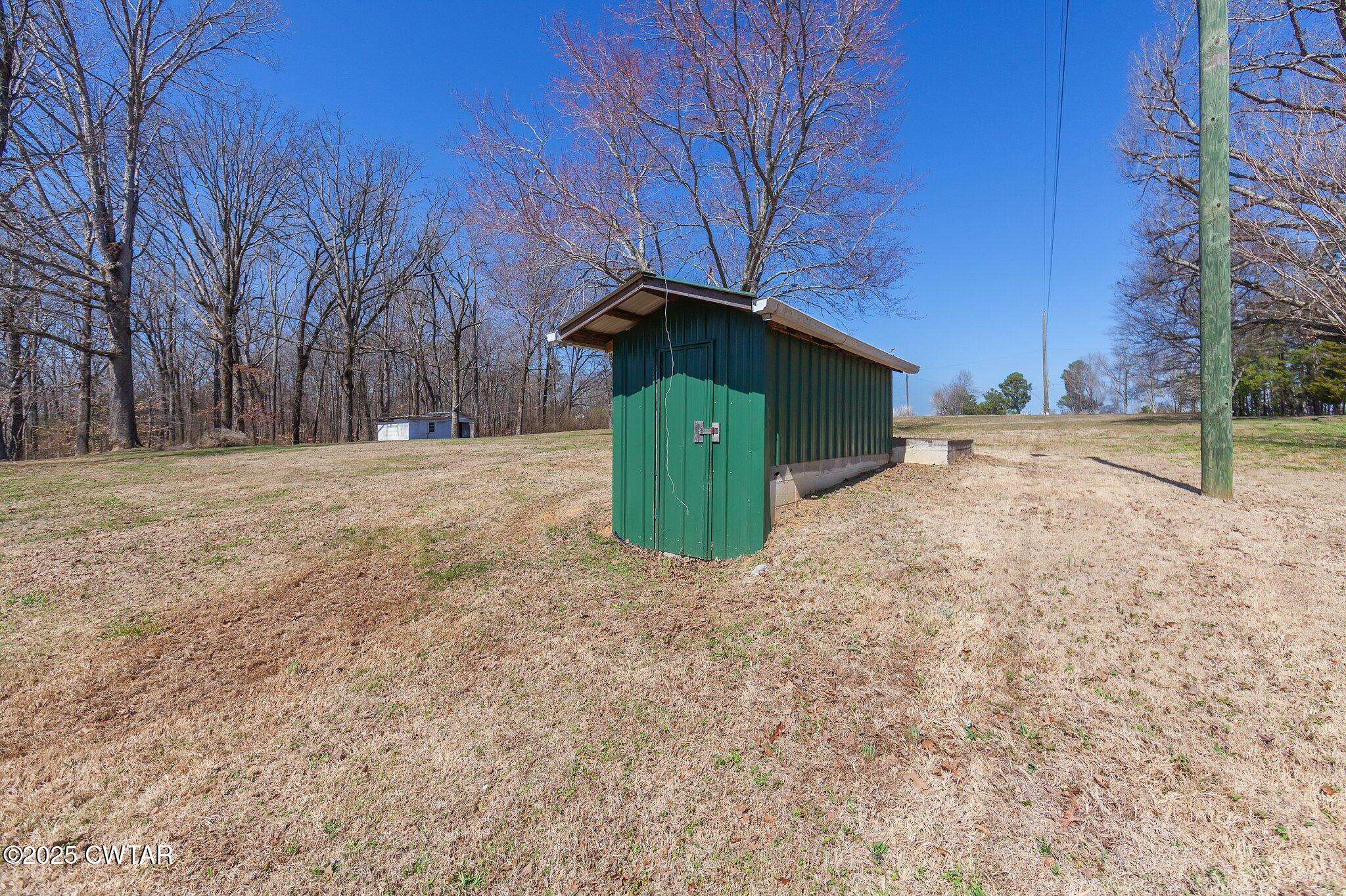 4260 Old Friendship Road Finger, TN 38334 - Photo 23 of 26 a backyard of a house with lots of green space