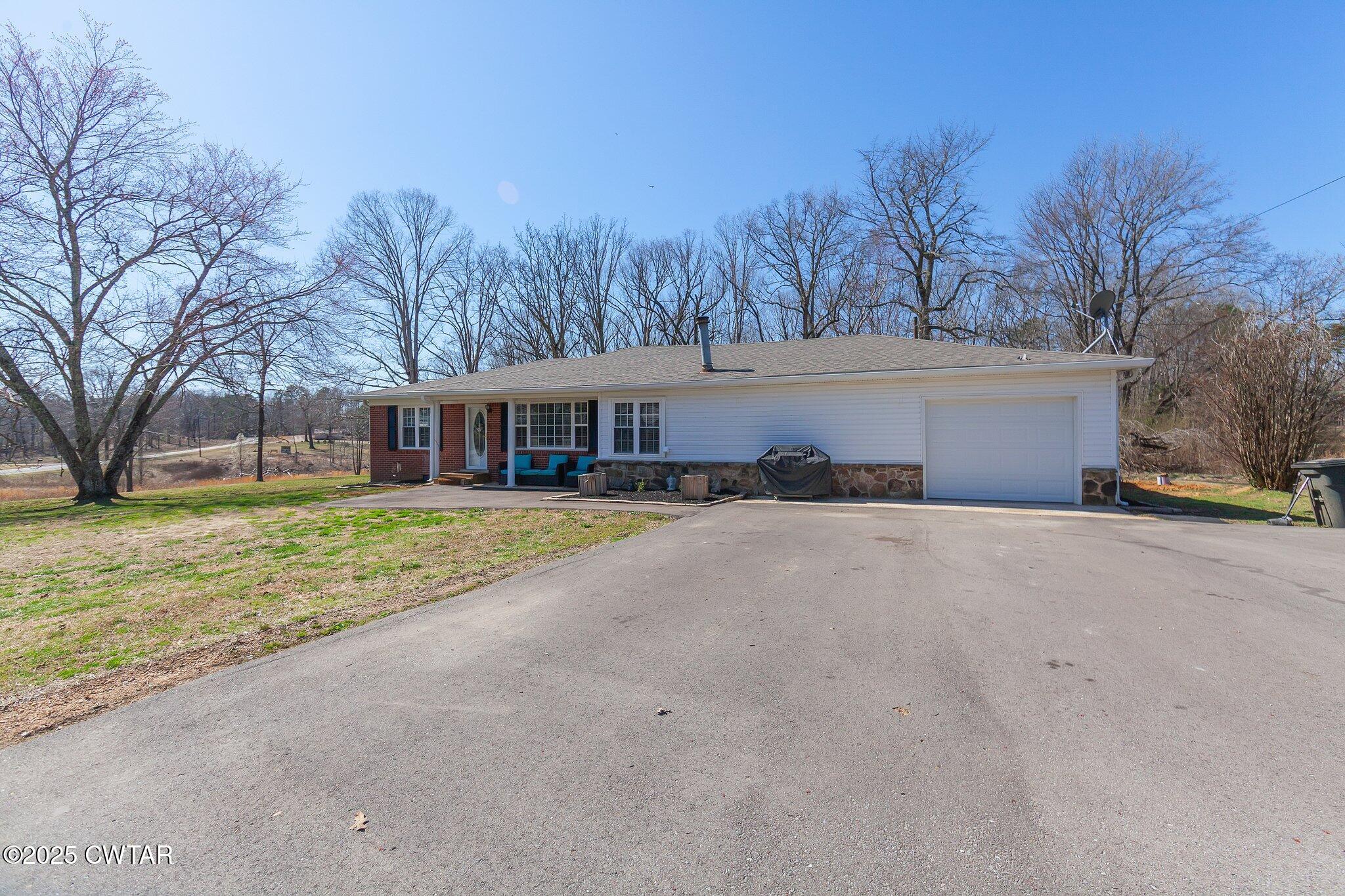 4260 Old Friendship Road Finger, TN 38334 - Photo 26 of 26 a front view of house with yard and trees all around
