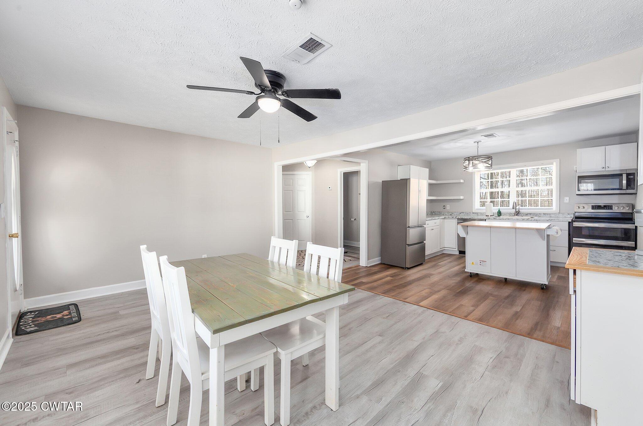 4260 Old Friendship Road Finger, TN 38334 - Photo 5 of 26 a living room with furniture and a wooden floor
