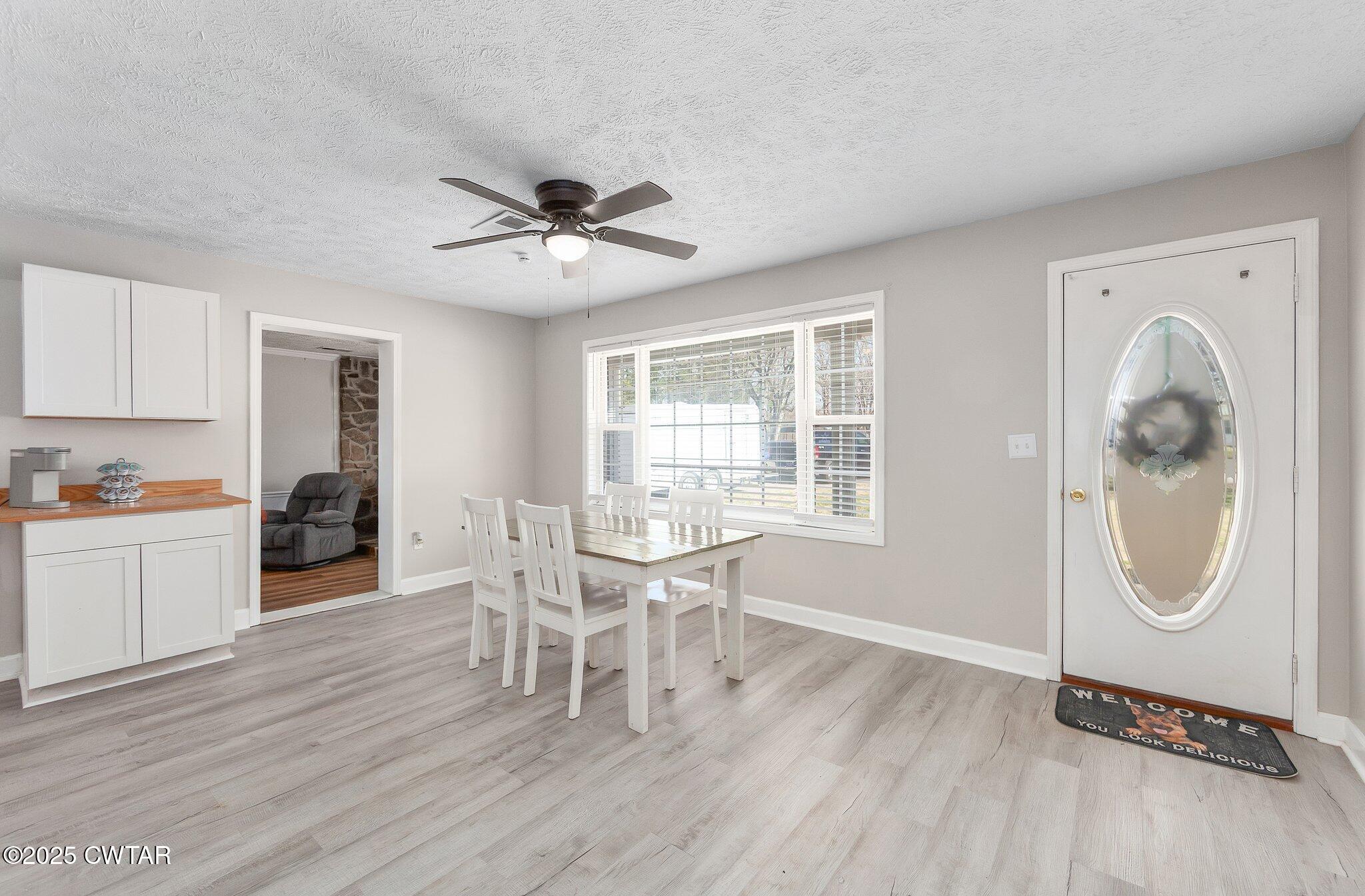 4260 Old Friendship Road Finger, TN 38334 - Photo 8 of 26 a view of a livingroom with furniture and wooden floor