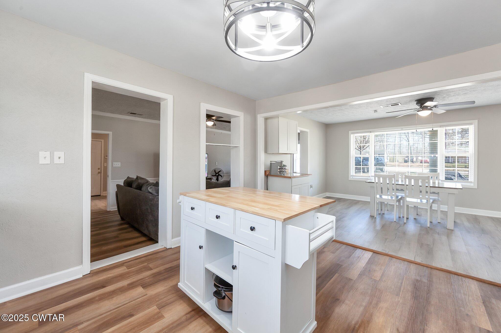 4260 Old Friendship Road Finger, TN 38334 - Photo 10 of 26 a view of a kitchen counter space wooden floor wooden floor and a view of living room