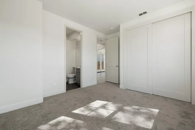 a bathroom with a sink toilet and a mirror