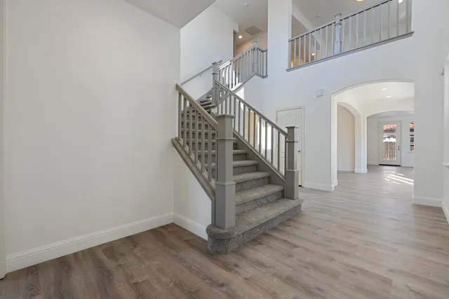 a bathroom with a sink mirror and toilet