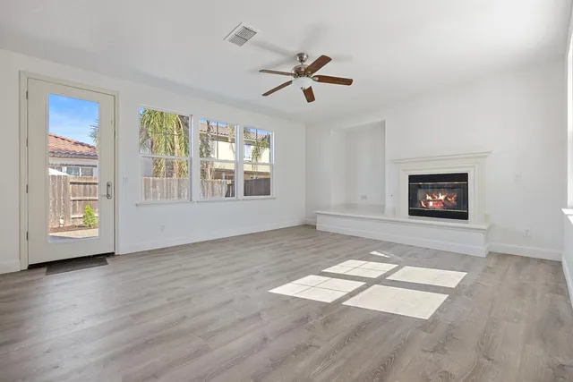 a view of kitchen with windows and ceiling fan