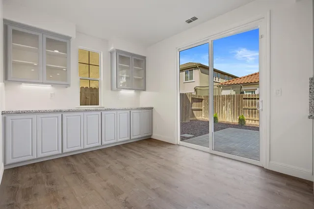 a view of staircase with white walls and a potted plant