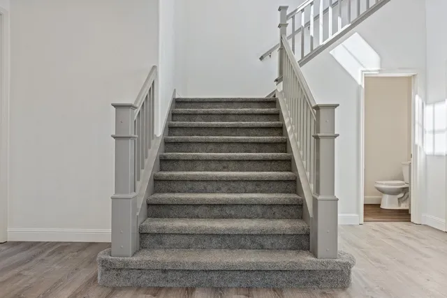 a view of a kitchen with furniture and windows
