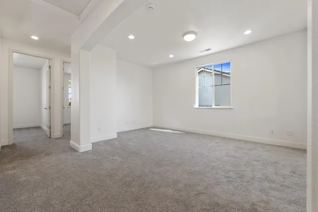 front view of a brick house with a large window