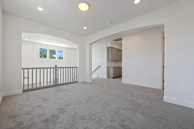 a view of a house with backyard and trees