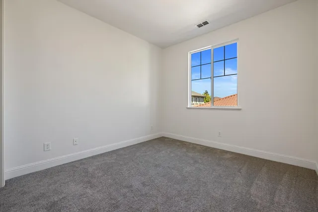 an aerial view of residential houses with city view