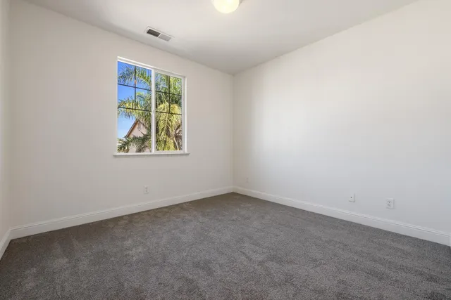 an aerial view of residential houses with city view