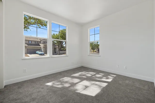a view of a big room with closet and chandelier fan
