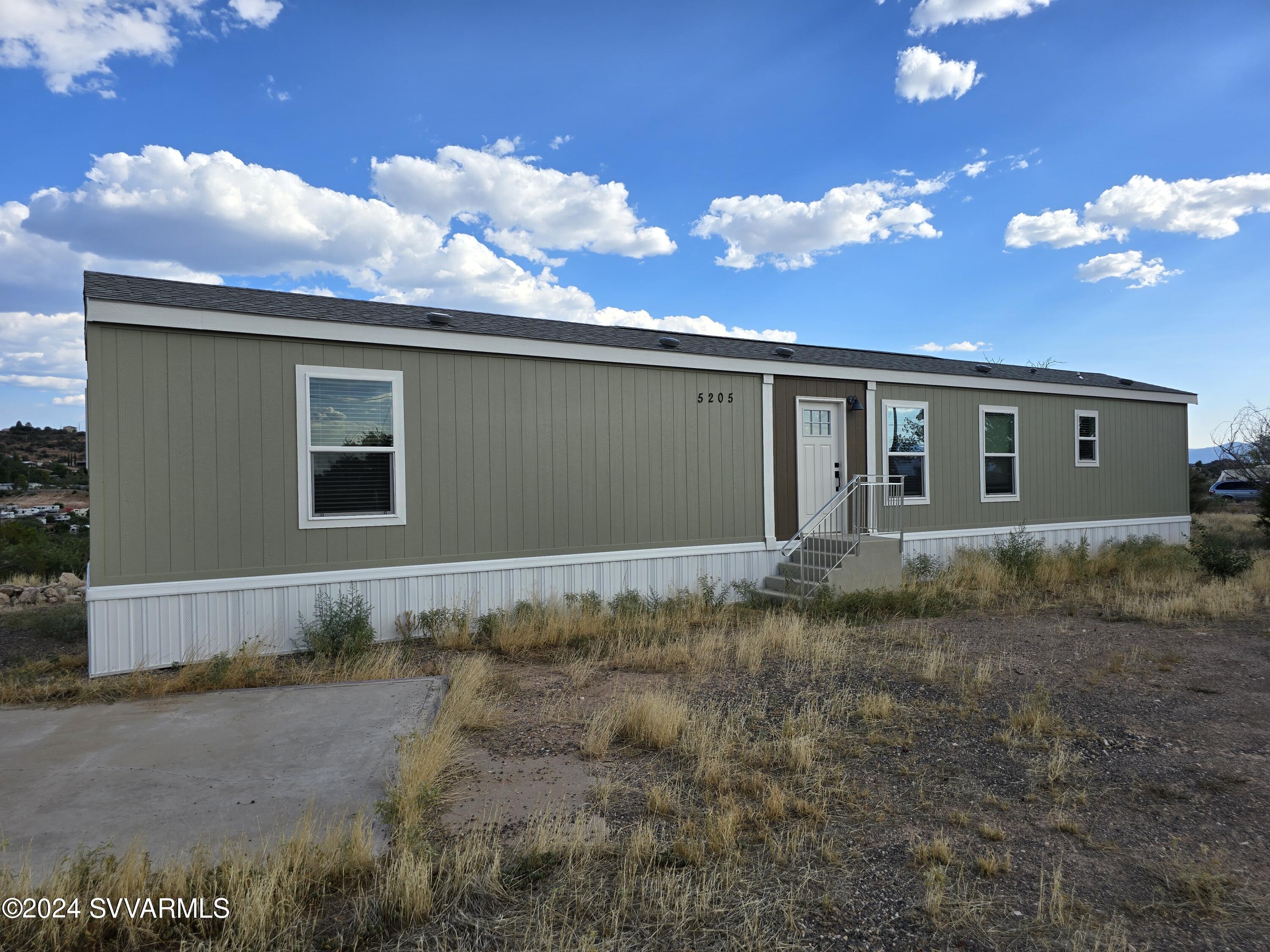 5205 Albatross Road Rimrock, AZ 86335 - Photo 1 of 23 a view of a house with a backyard