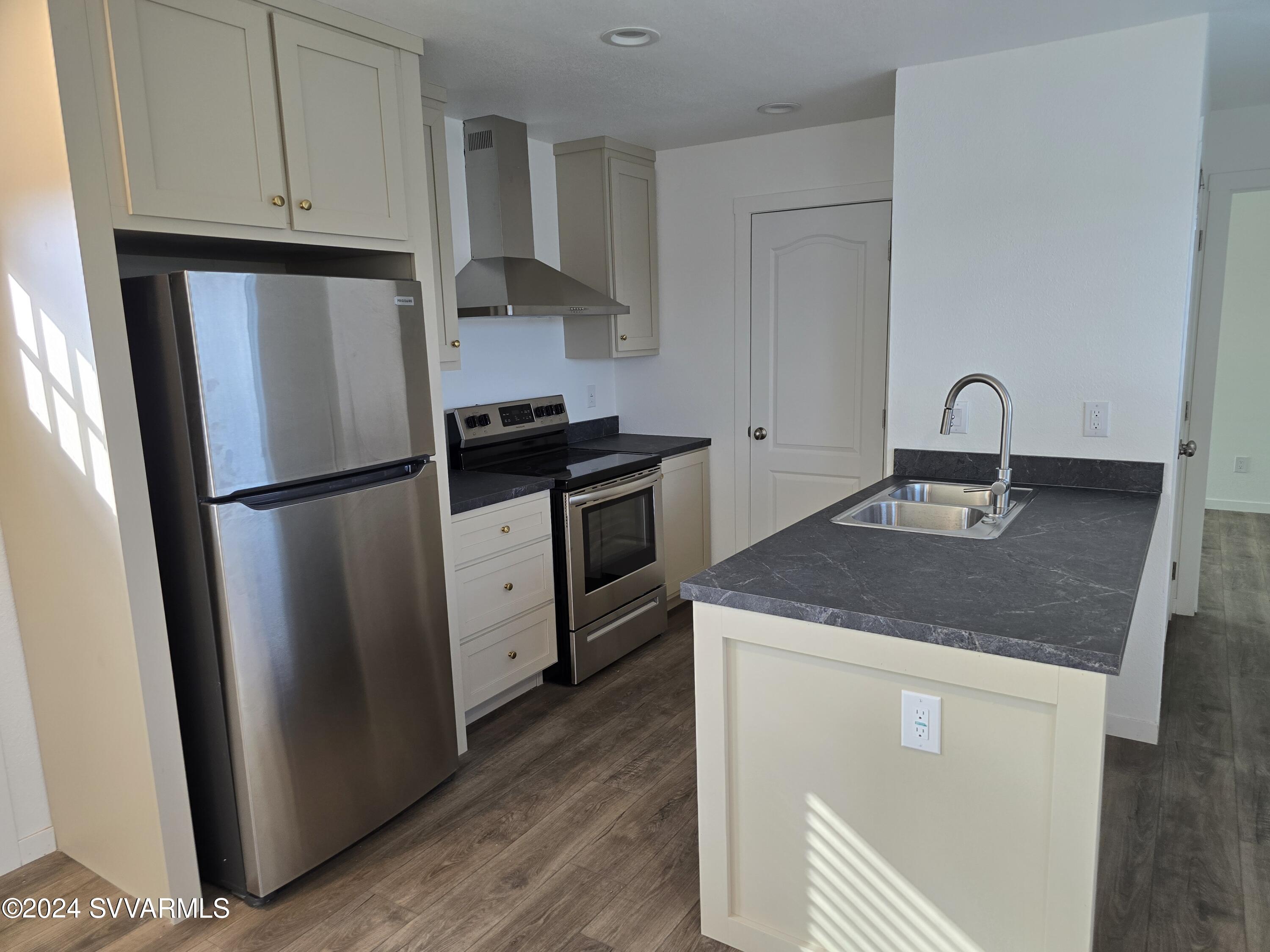 5205 Albatross Road Rimrock, AZ 86335 - Photo 11 of 23 a kitchen with a refrigerator stove and sink