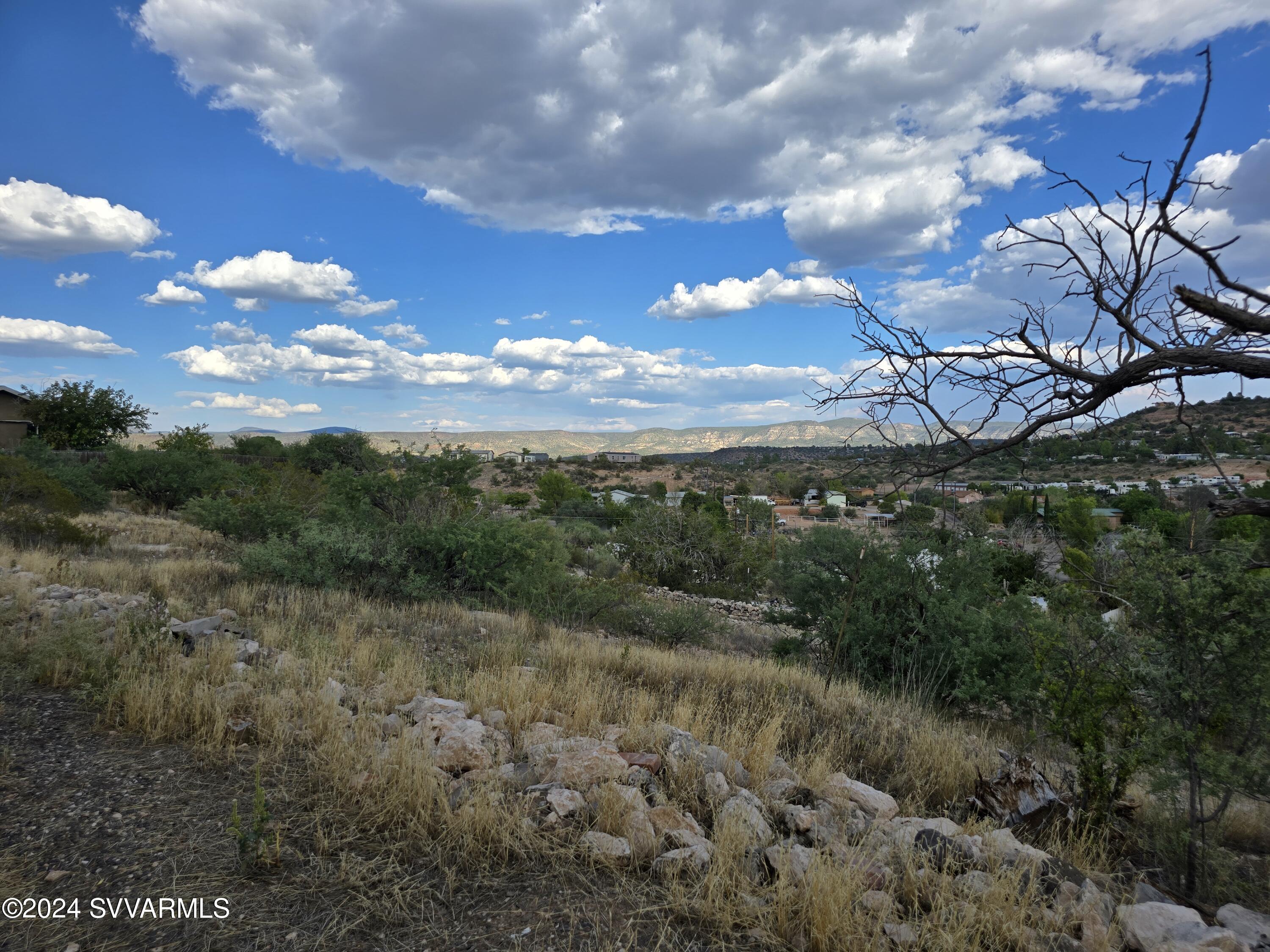 5205 Albatross Road Rimrock, AZ 86335 - Photo 8 of 23 a view of a big yard with lots of green space and mountain view
