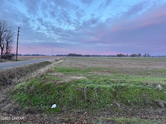 a view of a lake with a yard