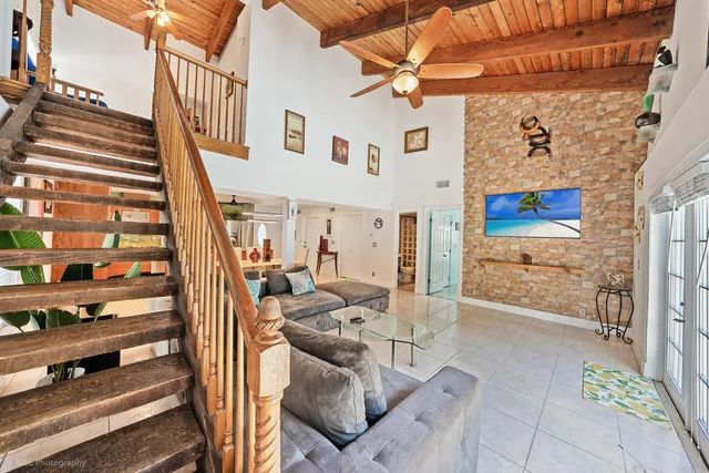 a view of a patio with table and chairs with wooden floor