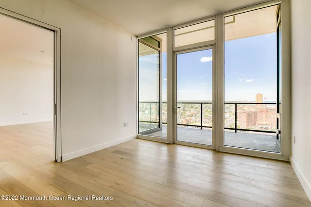 a living room with a couch and a lamp