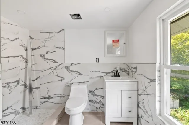 a bathroom with white shower