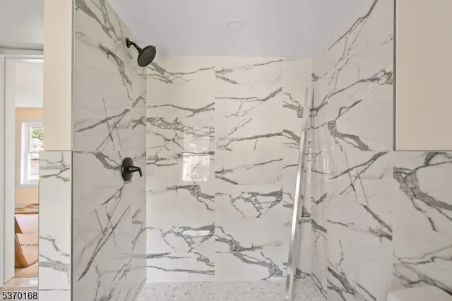 a view of room with window and hardwood