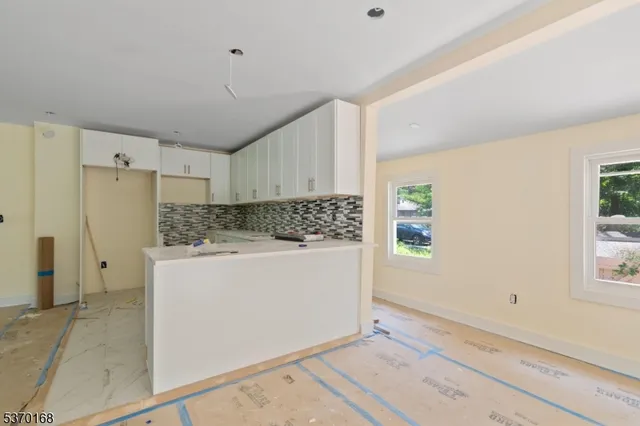 a room with a refrigerator and window