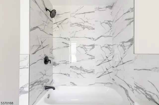 a bath tub sitting in a bathroom
