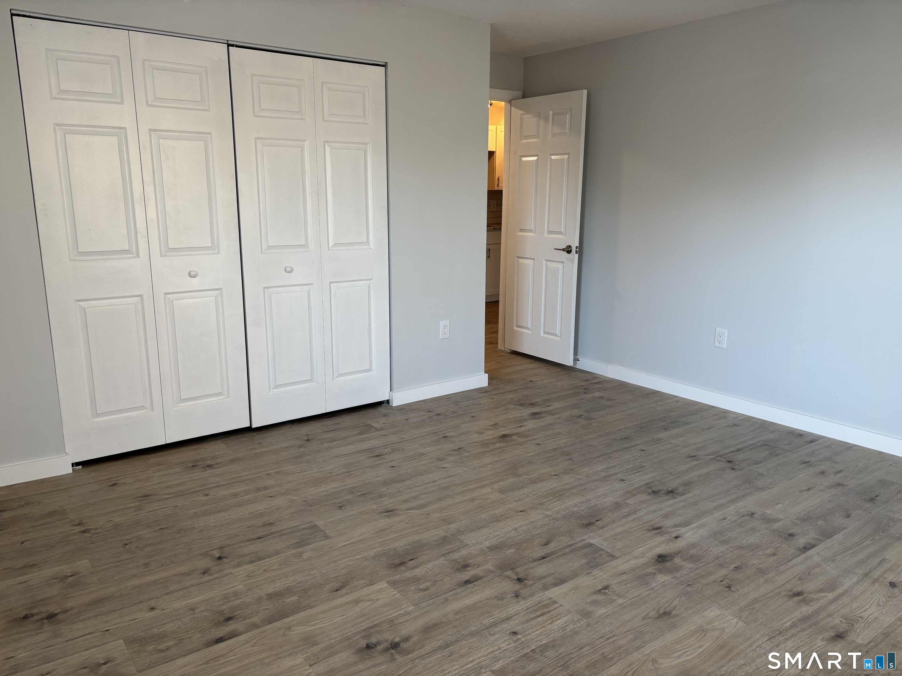 82 Longview Street, Unit 36 Waterford, CT 06385 - Photo 13 of 14 a view of an empty room with wooden floor
