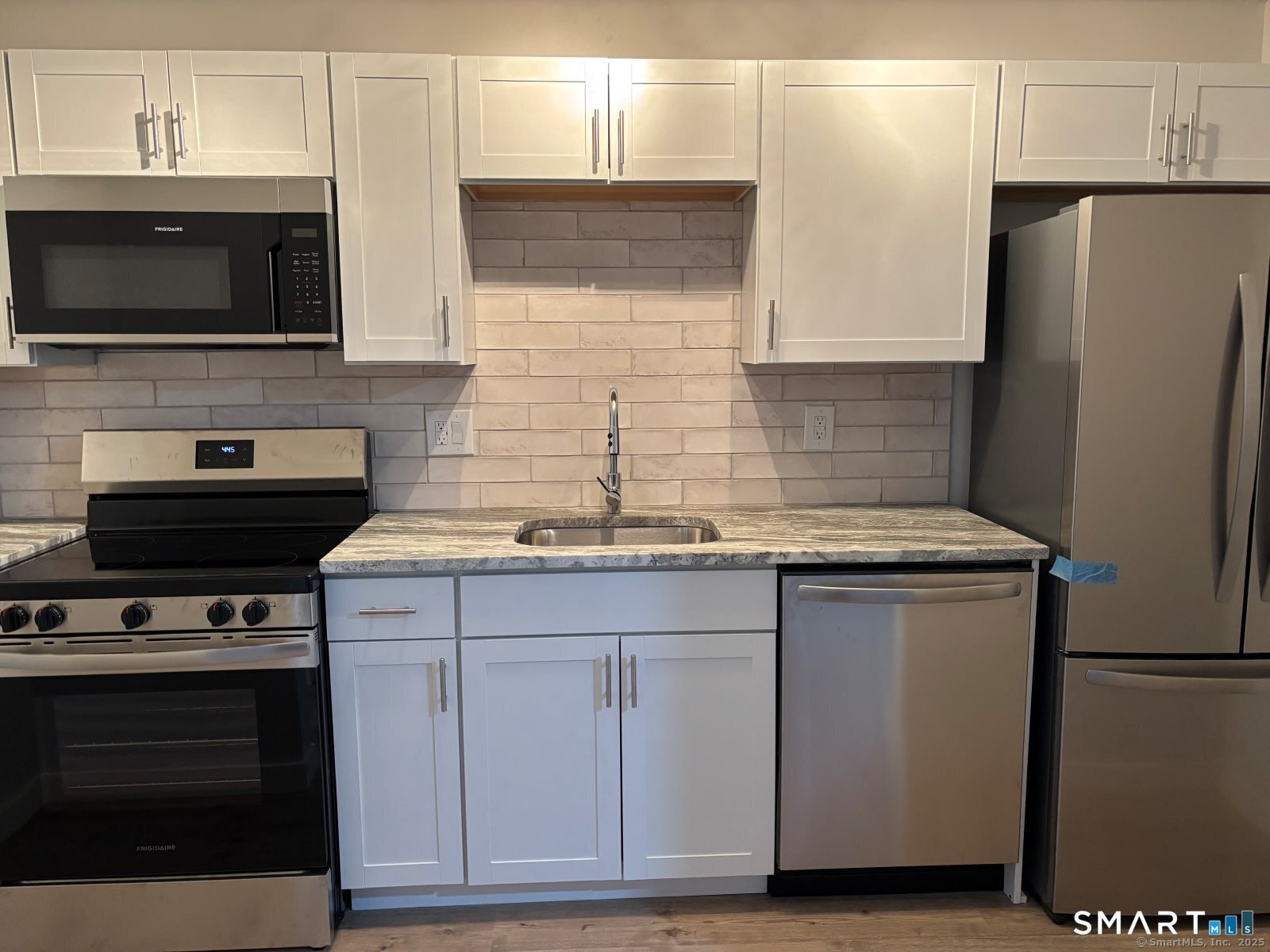 82 Longview Street, Unit 36 Waterford, CT 06385 - Photo 3 of 14 a kitchen with stainless steel appliances a stove microwave and refrigerator