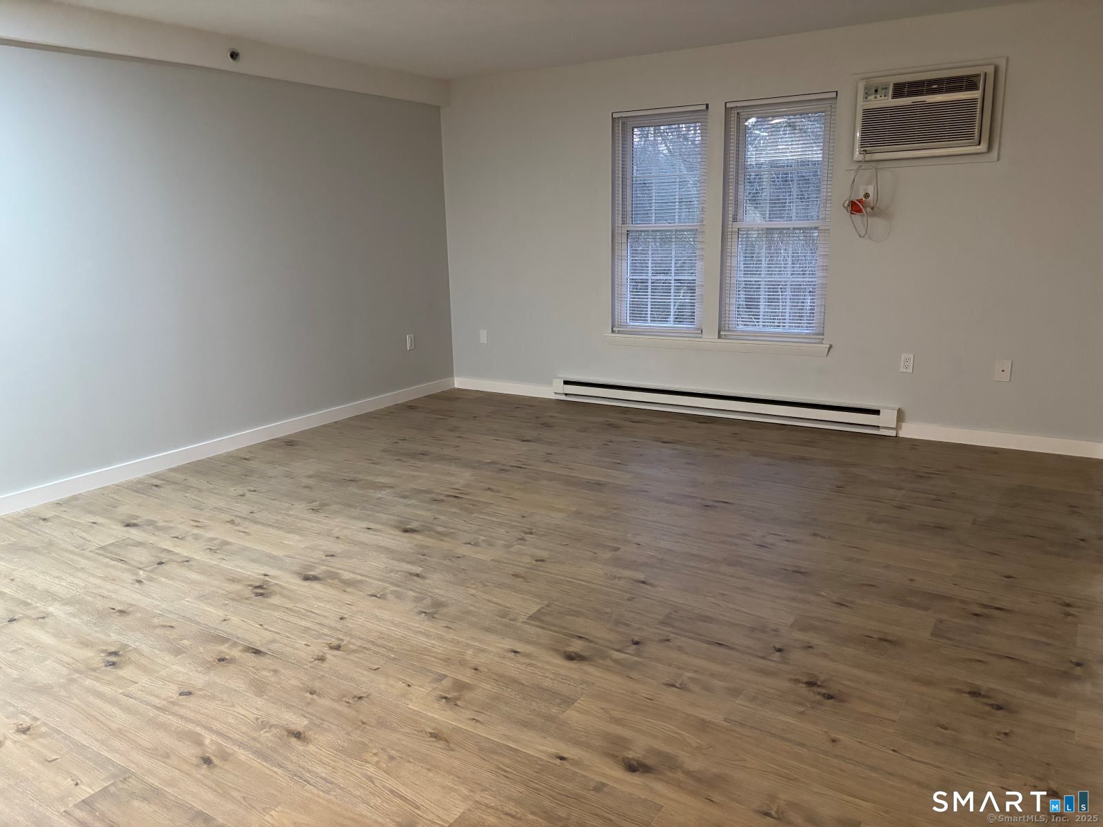 82 Longview Street, Unit 36 Waterford, CT 06385 - Photo 8 of 14 wooden floor in an empty room
