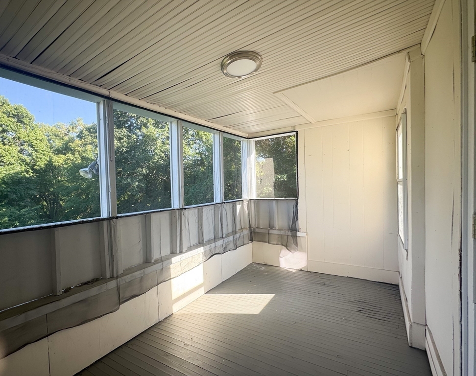 50-52 John Street Pittsfield, MA 01201 - Photo 15 of 24 a view of an empty room with wooden floor and a window