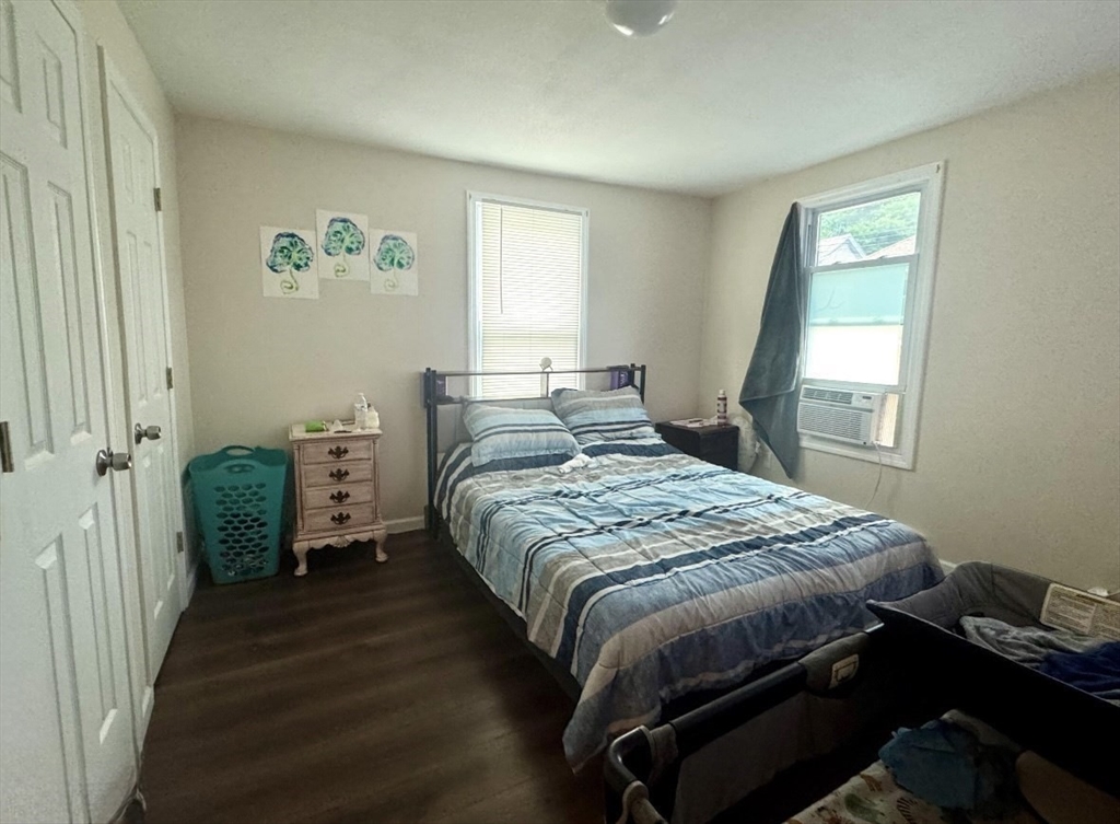 50-52 John Street Pittsfield, MA 01201 - Photo 4 of 24 a bedroom with a bed and a window