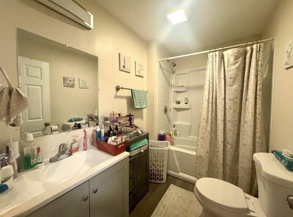 50-52 John Street Pittsfield, MA 01201 - Photo 7 of 24 a bathroom with a double vanity sink toilet mirror and shower