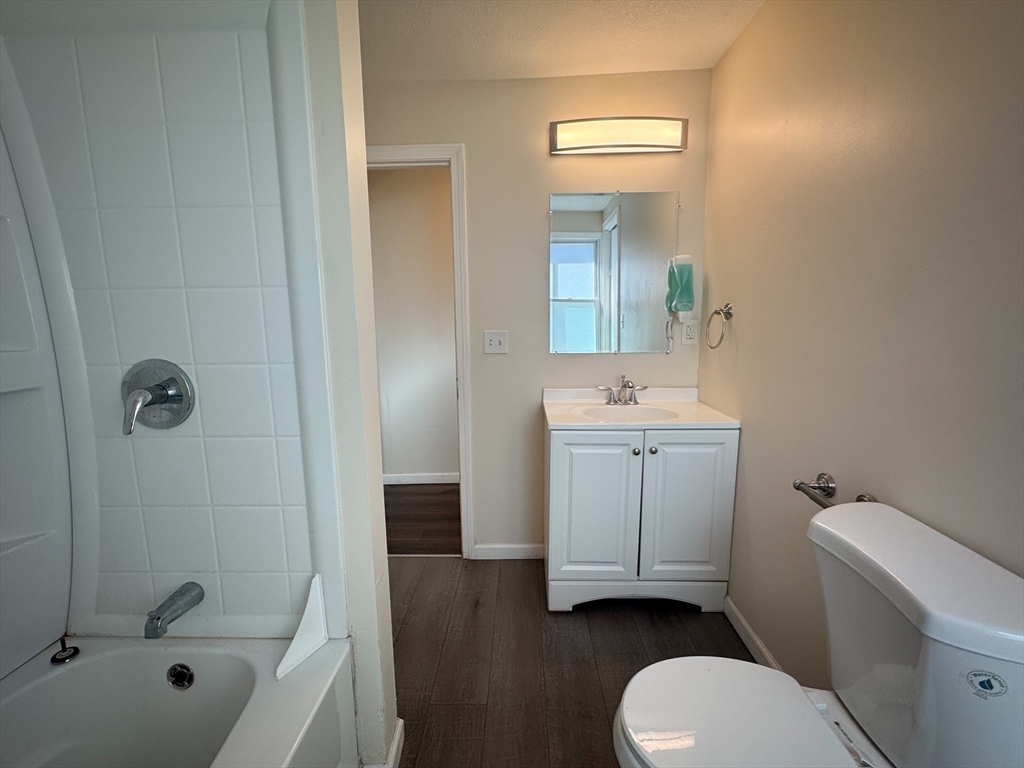 50-52 John Street Pittsfield, MA 01201 - Photo 9 of 24 a bathroom with a sink a toilet and shower