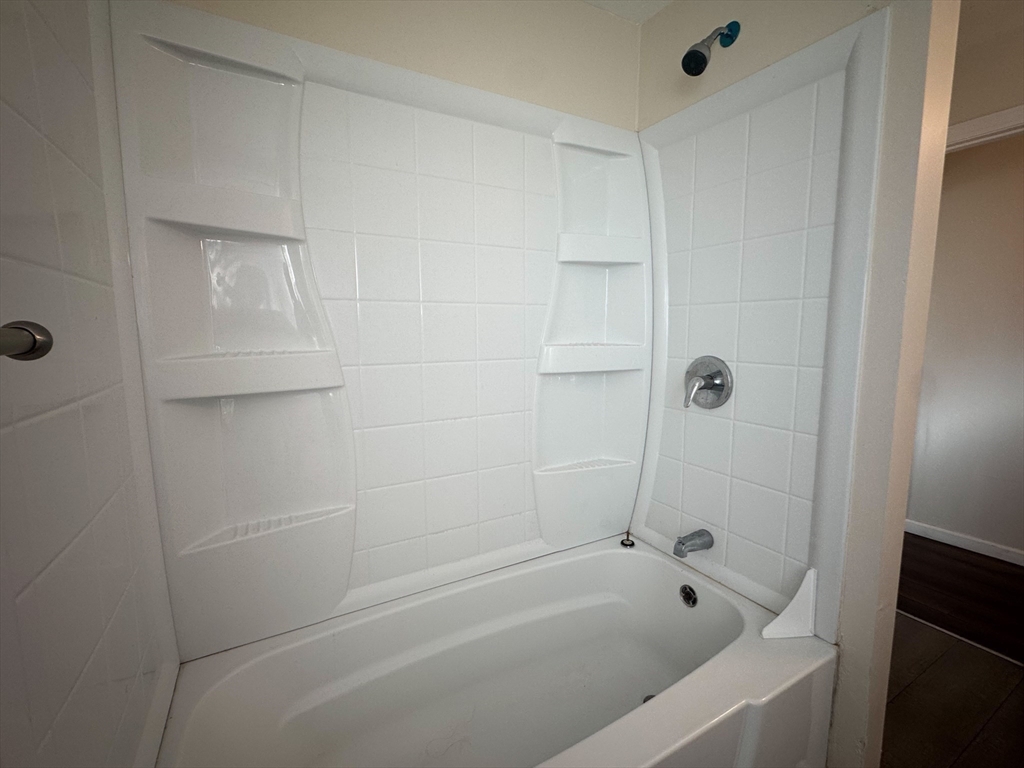 50-52 John Street Pittsfield, MA 01201 - Photo 10 of 24 a bathroom with a bathtub