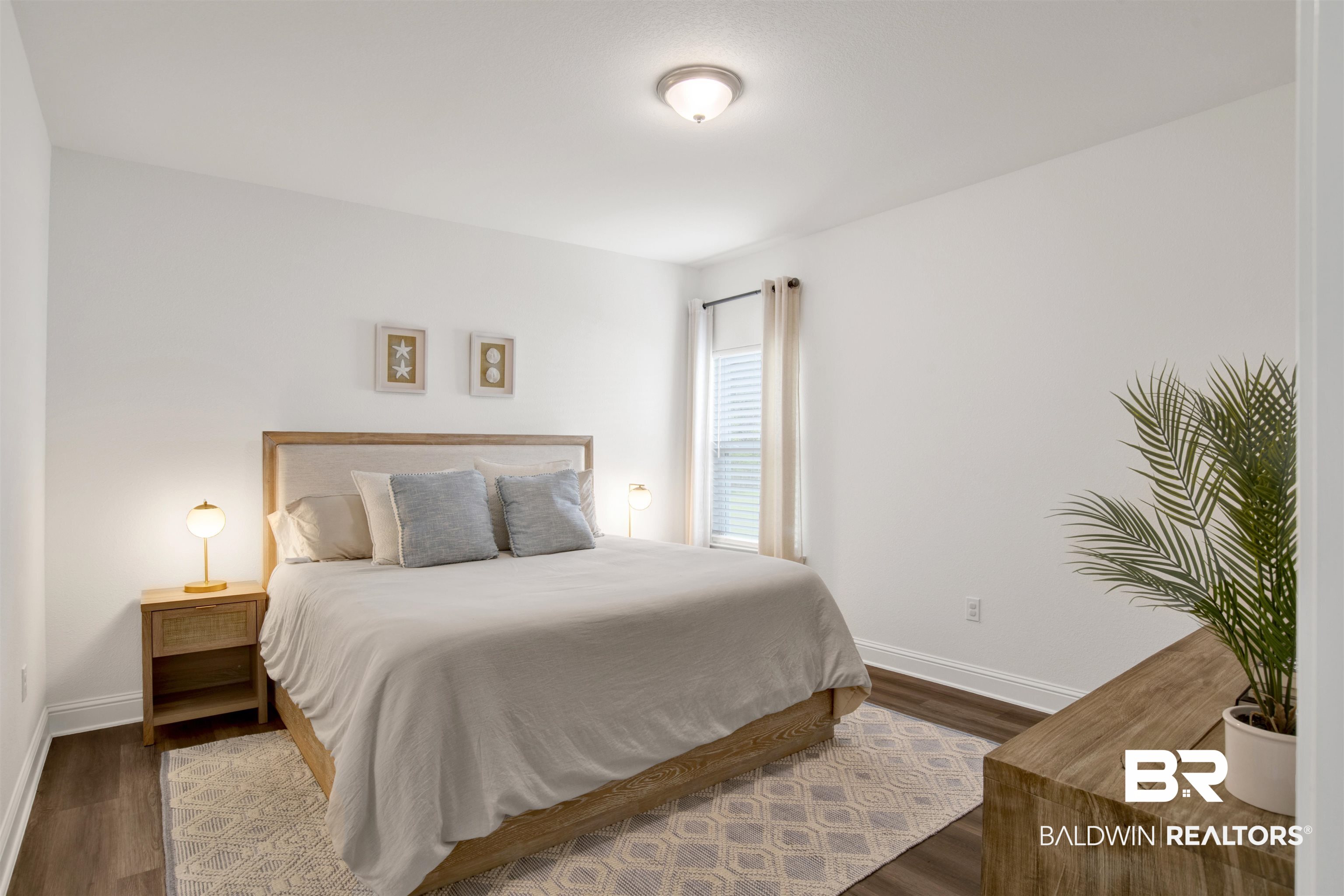594 Shepard Street Gulf Shores, AL 36542 - Photo 12 of 51 Bedroom with baseboards and wood finished floors